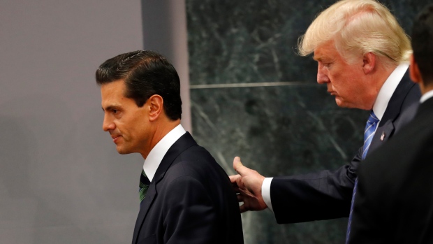 Republican presidential nominee Donald Trump walks with Mexico President Enrique Pena Nieto 