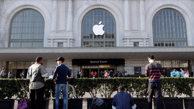 People wait outside the auditorium before Apple's product event, Sept. 7 2016 in San Francisco