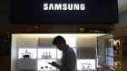 A man passes by a Samsung Electronics shop in Seoul, South Korea