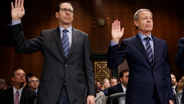 AT&T Chairman and CEO Randall Stephenson, left, and Time Warner Chairman and CEO Jeffrey Bewkes. 