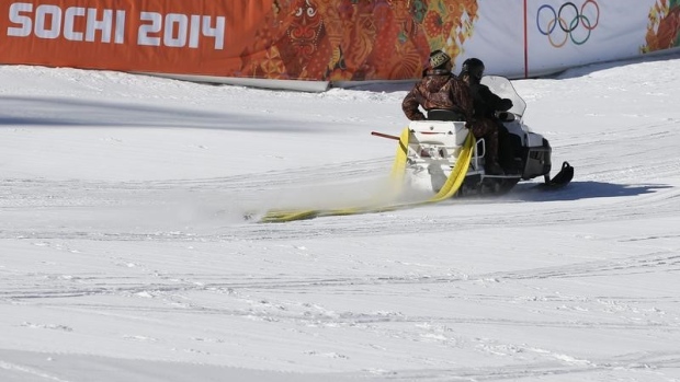 A ski-doo passes the finish area of the Alpine Skiing events of the Sochi 2014 Winter Olympic Games.