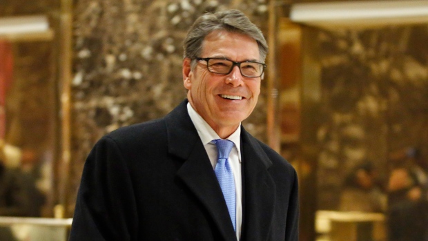 Rick Perry smiles as he leaves Trump Tower in New York. 