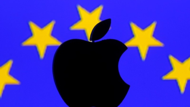 A 3D printed Apple logo is seen in front of a displayed European Union flag