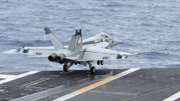 An F/A-18 Super Hornet takes off from the desk of the nuclear-powered USS George Washington 