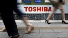 A logo of Toshiba Corp outside an electronics retailer in Tokyo, Japan.