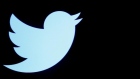 Twitter logo displayed on a screen on the floor of the New York Stock Exchange