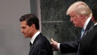 Donald Trump walks with Mexico President Enrique Pena Nieto in August