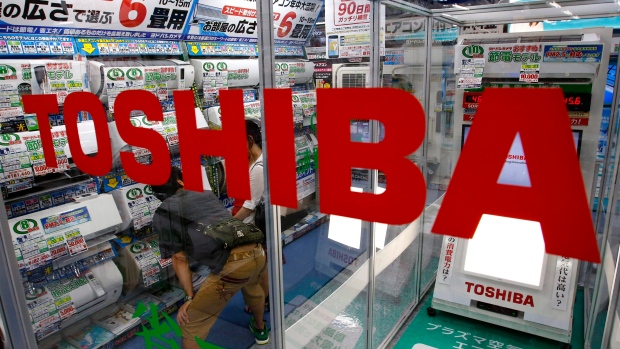 A Toshiba logo is displayed at an electronics store in Tokyo