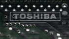 A logo of Toshiba Corp is seen on a printed circuit board