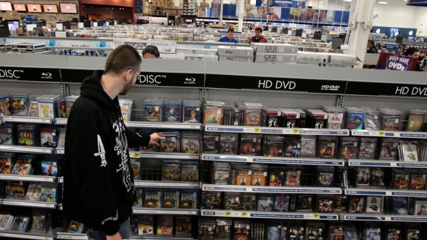 A customer shops for DVDs and Blu Rays at a Best Buy store in Burbank, Calif. in 2008