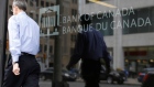A man walks past the Bank of Canada office in Ottawa