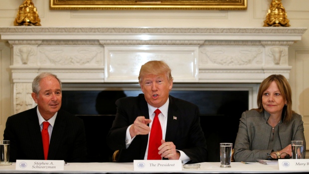 Trump flanked by Blackstone CEO Stephen Schwarzman and General Motors CEO Mary Barra