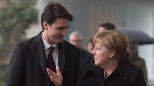 Justin Trudeau speaks with German Chancellor Angela Merkel in Berlin, Germany, Feb. 17 2017.  