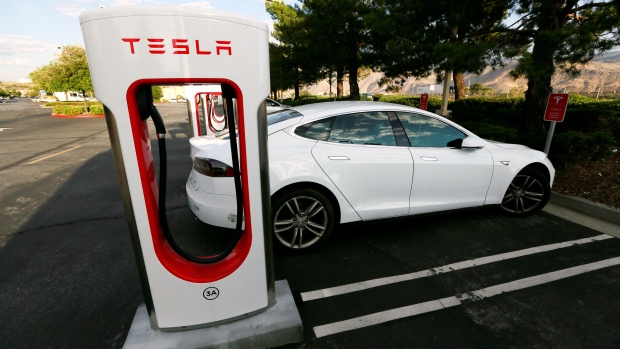 A Tesla Model S charges at a Tesla Supercharger station in Cabazon, California