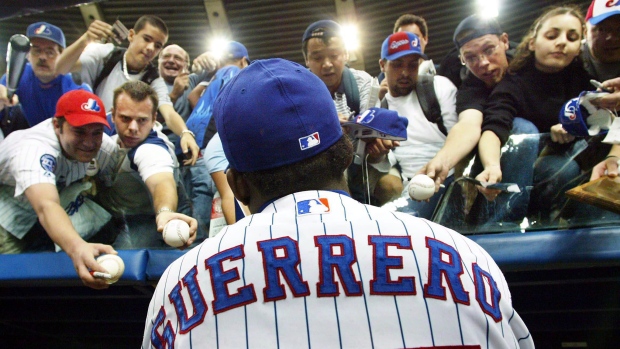 Montreal baseball fans clamour for Vladimir Guerrero's autograph at a 2014 Blue Jays exhibition game
