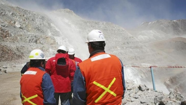 Workers walk near Barrick Gold Corp's Veladero gold mine in Argentina