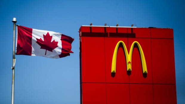  A Canadian flag waves beside McDonalds fast food restaurant in Toronto, May 1, 2014. 