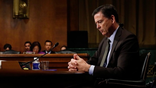 Former -FBI Director James Comey pauses as he testifies on Capitol Hill in Washington on May 3