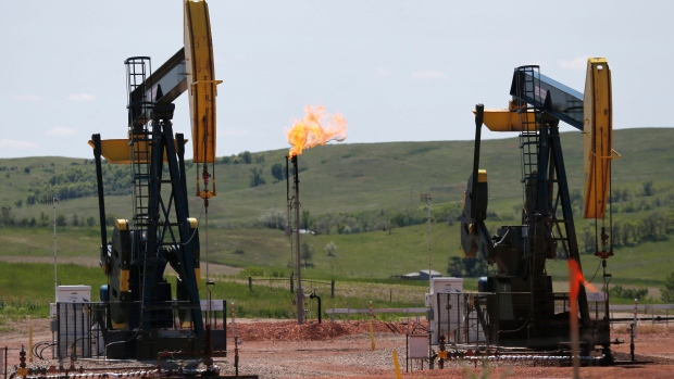 methane In this June 12, 2014 file photo, oil pumps and natural gas burn off in Watford City, N.D. 