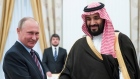 Russian President Vladimir Putin shakes hands with Saudi Deputy Crown Prince Mohammed bin Salman 