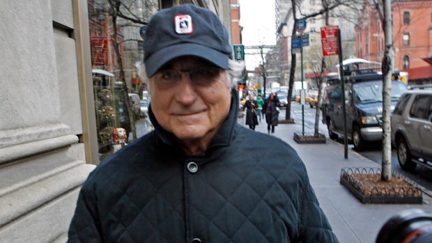 2008 file photo, Bernard Madoff returns to his Manhattan apartment after making a court appearance