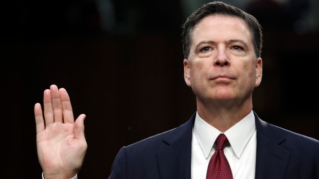 Former FBI director James Comey is sworn in during a Senate Intelligence Committee hearing