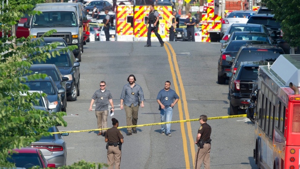 Emergency personnel are seen near the scene where House Majority Whip Steve Scalise of La. was shot.