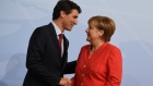German chancellor Angela Merkel welcomes Canada's Prime Minister Justin Trudeau at the G-20 