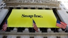 The front of the New York Stock Exchange with a Snap Inc. logo