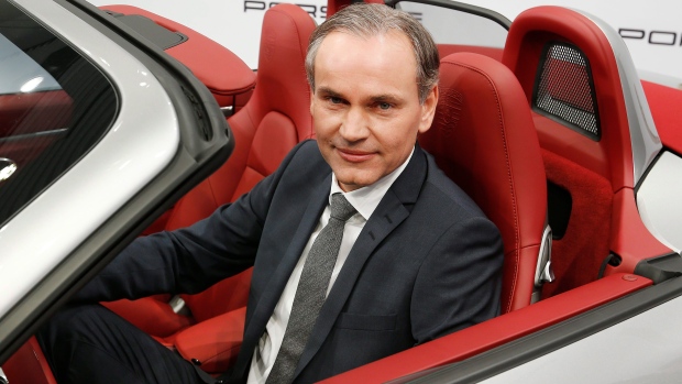 Porsche CEO Oliver Blume sits in a Porsche Boxster prior to the company's annual press conference 