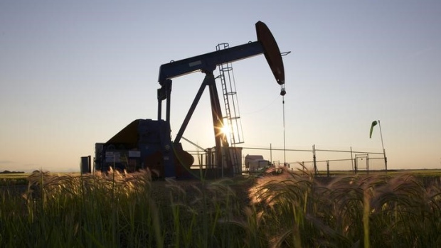 An oil pump jack pumps oil in a field near Calgary, Alberta, July 21, 2014