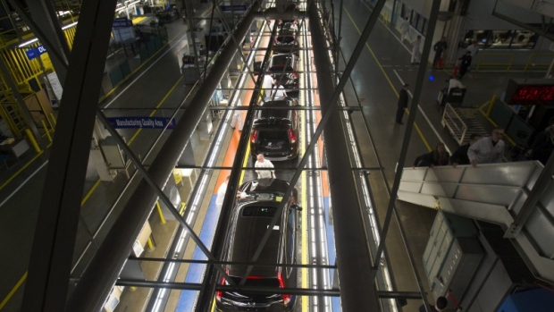 Production Associates inspect cars moving along assembly line at Honda plant in Alliston, Ont.  