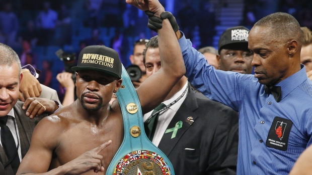 Floyd Mayweather celebrates his victory over Manny Pacquiao in 2015