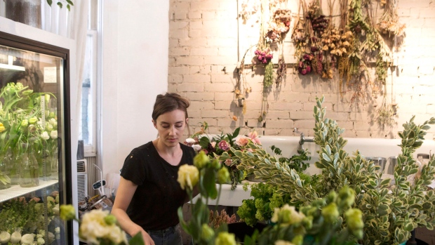 Flowers are arranged at the Coriander Girl florist shop in Toronto