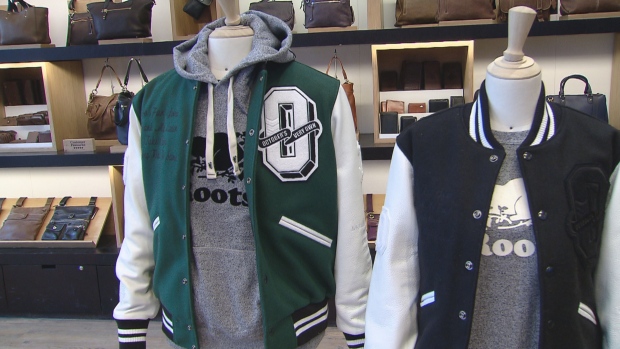 Clothing - including Drake's October's Very Own brand - is displayed at a Roots Canada store