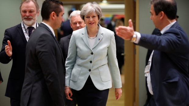 Britain's Prime Minister Theresa May and Britain's EU Ambassador Tim Sparrow