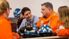 Prime Minister Justin Trudeau speaks with workers during a visit to Stelco Hamilton