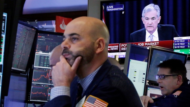 Traders watch Federal Reserve Chairman Jerome Powell