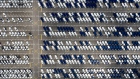 Vehicles sit parked in a lot in this aerial photograph in South Korea