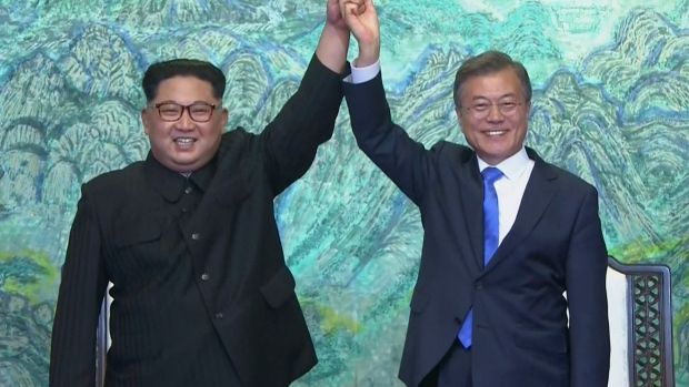 North Korean leader Kim Jong Un, left, and South Korean President Moon Jae-in