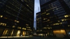 Office towers light up in the evening in the financial district of Toronto, Ontario, Canada, on Friday, May 22, 2020. Photographer: Cole Burston/Bloomberg
