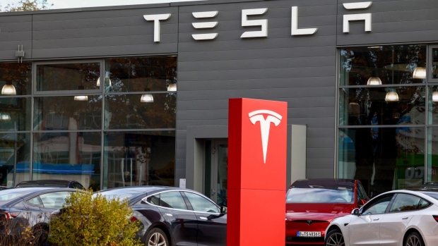 A Tesla Inc. electric vehicle dealership in Berlin, Germany, on Tuesday, Nov. 7, 2023. Tesla will produce a new model that will cost €25,000 ($26,863) at its factory near Berlin, Reuters reported, as competition intensifies to produce more affordable electric vehicles for the European market. Photographer: Liesa Johannssen-Koppitz/Bloomberg