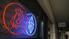 The neon logos of Bitcoin and Ethereum cryptocurrencies in the window of a crypto exchange in Warsaw, Poland, on Thursday, March 14, 2024.