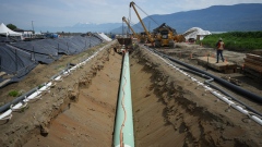 Workers lay pipe