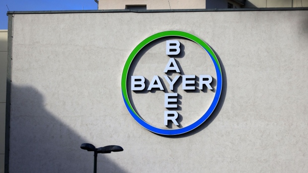 The logo of Bayer AG at the company's pharmaceutical campus in Berlin, Germany, on Monday, Feb. 27, 2023. Bayer AG sees lower profit this year as it contends with falling prices for agriculture products in its crop science division, although the pharma division will probably see another year of about 1% sales growth and the consumer health unit could see sales rise by about 5%, it said. Photographer: Krisztian Bocsi/Bloomberg