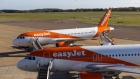 <p>EasyJet passenger jets at London Luton Airport.</p>
