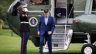 US President Joe Biden, right, walks on the South Lawn of the White House after arriving on Marine One in Washington, DC, US, on Wednesday, April 17, 2024. The Biden administration reimposed oil sanctions on Venezuela, ending a six-month reprieve, after determining that Nicolas Maduro's regime failed to honor an agreement to allow a fairer vote in elections scheduled for July. Photographer: Ting Shen/Bloomberg