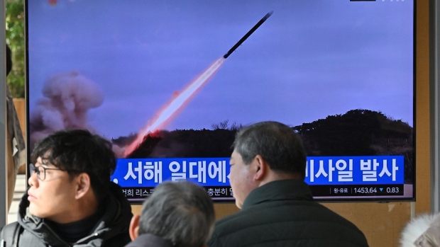 People watch a television screen showing a news broadcast with file footage of a North Korean missile test, at a railway station in Seoul on January 24, 2024. Photographer: Jung Yeon-Je/AFP/Getty Images
