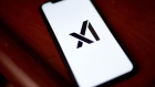 The xAI logo on a smartphone arranged in New York, US, on Thursday, Dec. 7, 2023. Elon Musk's artificial intelligence company xAI is seeking to raise $1 billion in funding from equity investors, according to a new filing. Photographer: Gabby Jones/Bloomberg