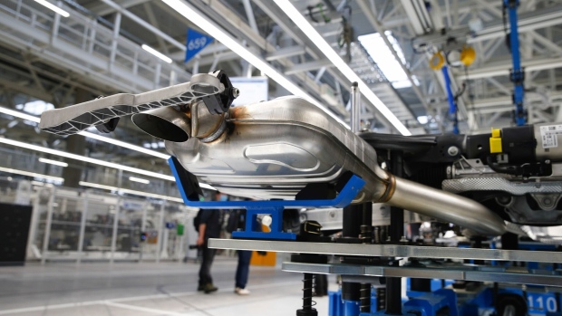 <p>An exhaust unit on production line at a Mercedes-Benz factory in Sindelfingen, Germany.</p>